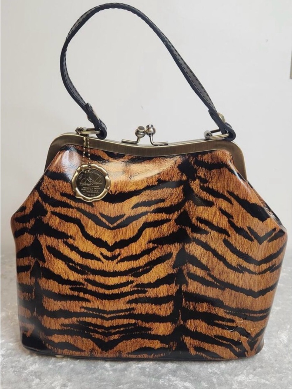 Patricia Nash tiger-print leather Novella frame handbag